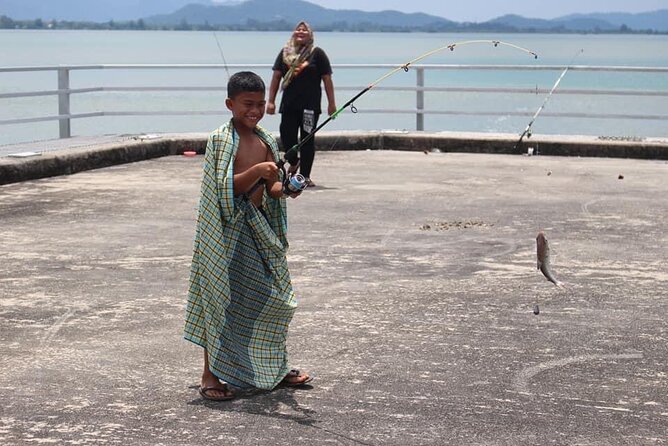 Private Half Day Cycling Tour in Langkawi - Stop 1 in Kuala Teriang: fisherman village energy and jetty photos