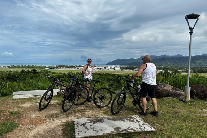 Private Half Day Cycling Tour in Langkawi - Stop 4 at Langkawi Lagoon: pedaling near water with Cable Car Matchinchang views