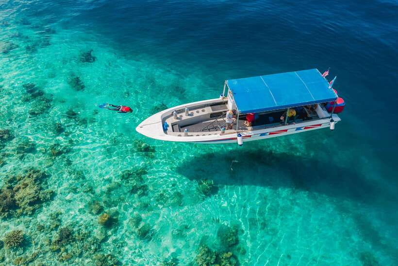 Semporna: Explore 3 Islands Tour Snorkel or Dive & Lunch - Mataking Island: secluded snorkel time over coral country